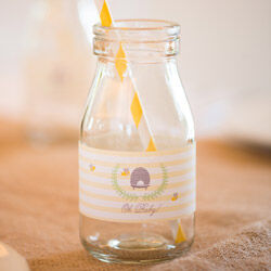 Mini milk bottles from The Party Parlour ($2.50 ea), personalised labels by Love JK ($1.49 per label)
