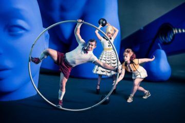 Circus Oz actors with assortment of ball props