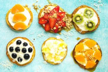 pancakes topped with fruit and yoghurt