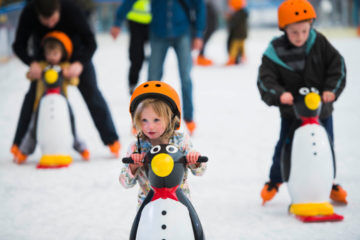 river rink ice skating little girl penguin