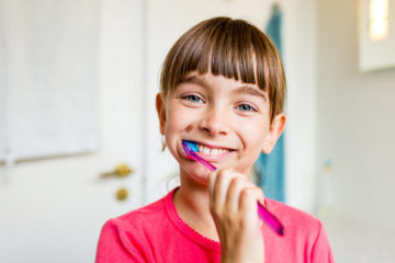 Girl brushing teeth