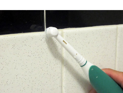Clean grout with an electric toothbrush