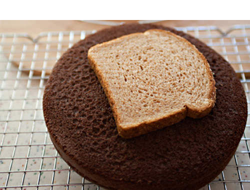 Place a slice of bread on a cake to keep it fresh overnight