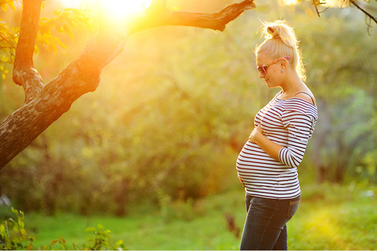 Pregnant mum in sunlight