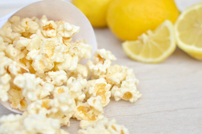 popcorn spilling out of a cup onto the table