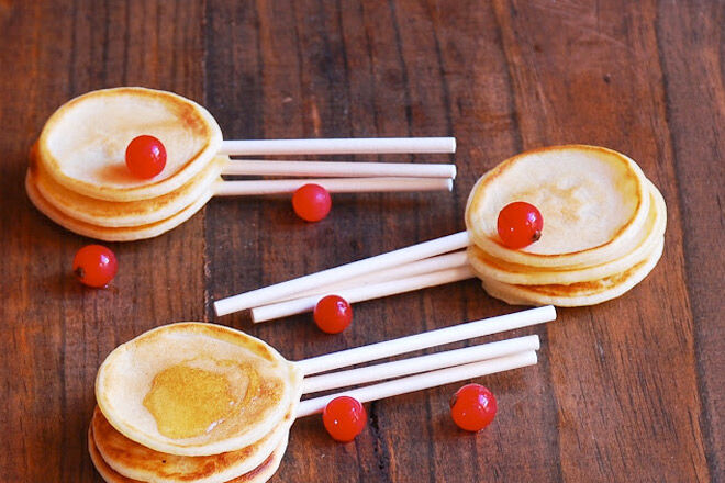 Sweet mini pancakes on sticks