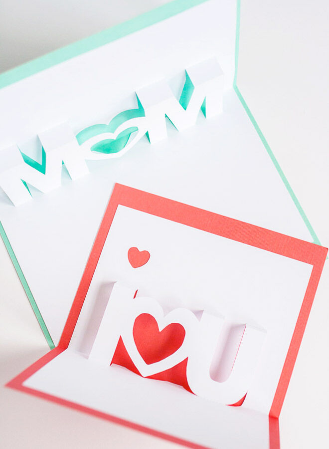 Homemade pop-up card with text reading 'Mom' and 'I heart you'