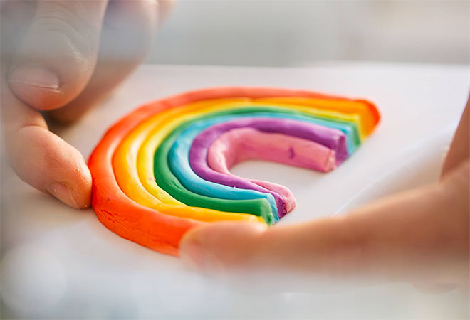 A rainbow made out of LUSH's bubble bath playdough
