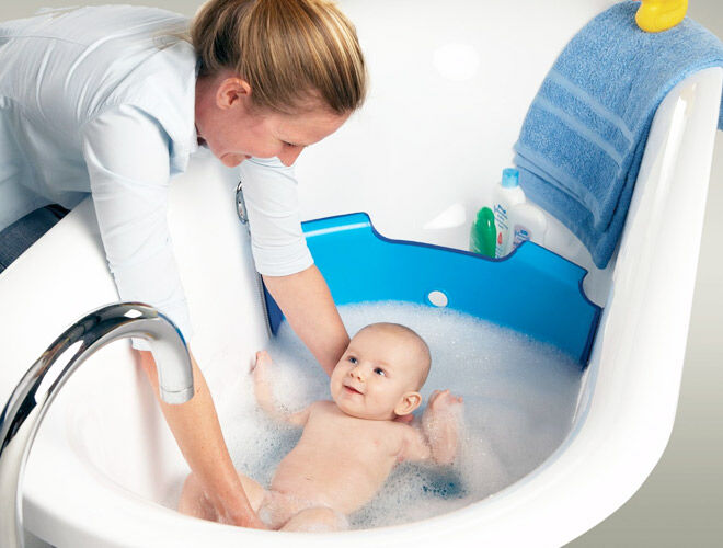The Baby Dam bathwater barrier turns your family-sized bath into a baby bath 