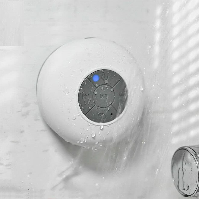 A waterproof speaker stuck to the bathroom wall