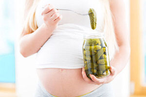 Pregnant belly eating pickles