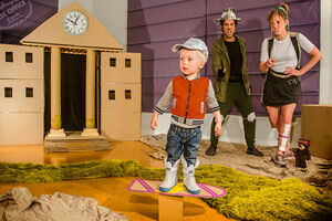 Family use cardboard boxed to recreate famous scenes