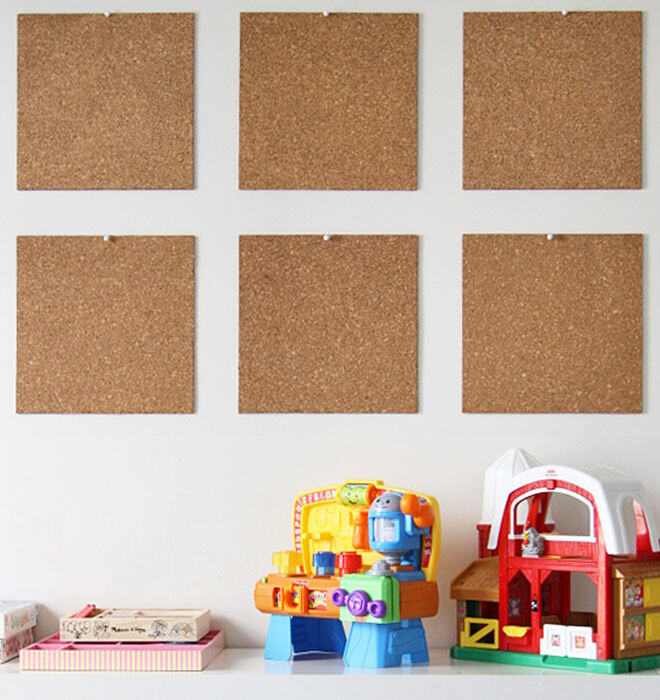 Inexpensive cork tiles are a great way to showcase your little ones artwork. If you're renting you could use 3M hanging strips on the back to protect your walls.