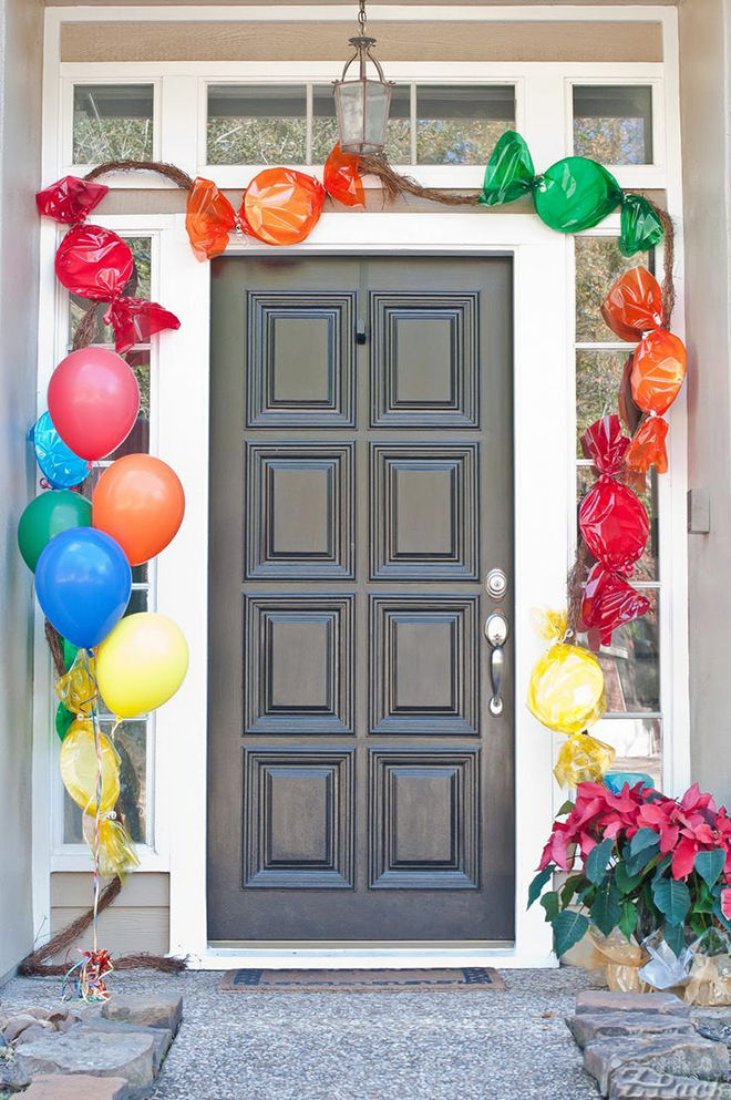 Paper plates and cellophane are used to make this front door look like lolly heaven for the little ones. 