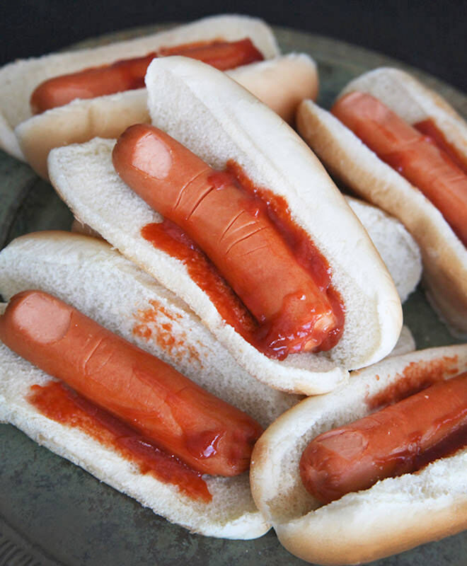 Halloween Hot Dogs! Some tomato sauce and strategically placed cuts can turn a hot dog turns into a finger!