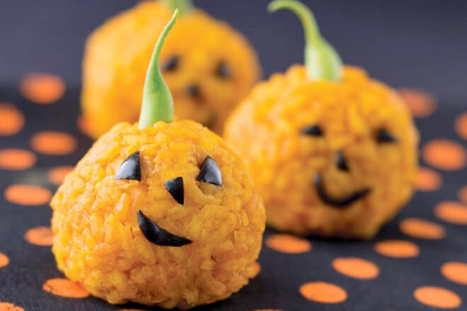 Coloured with carrot juice rather than food colouring, these rice balls make the perfect side to your nipper's haunted house tucker.