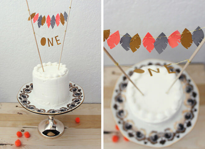 First birthday cake with adorable feather cake topper