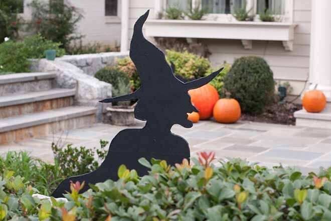 Black whitch figures in amongst the bushes will give people a fright before they come knocking this Halloween