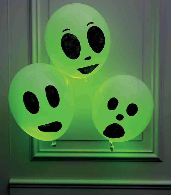 Chuck a glow stick in a balloon and draw a face on it. Simple spooky DIY for Halloween