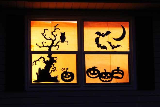 Make a Halloween window by simply using stencils and black cardboard