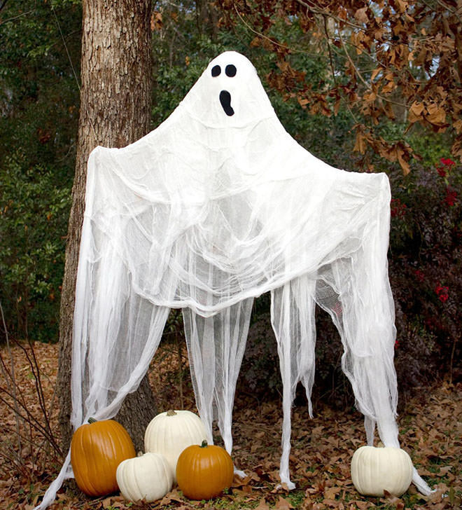 Cheesecloth makes the easiest and scariest ghosts for the back yard.