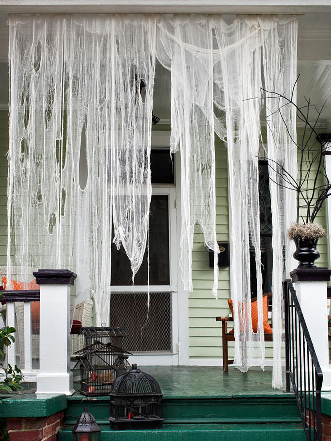 Drape cheesecloth over the front porch to create a spooktacular scene