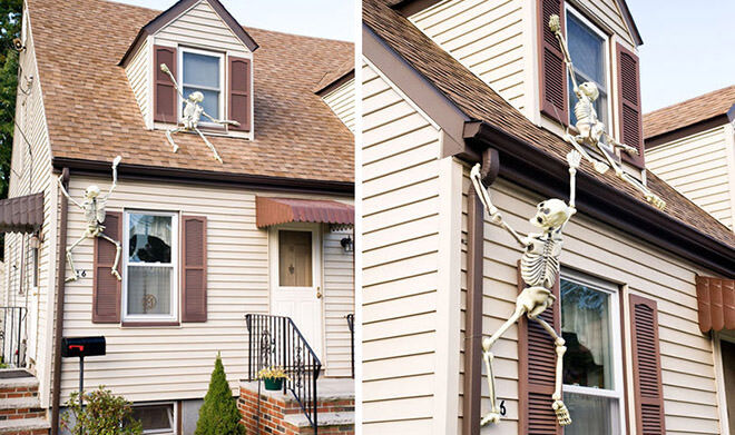 Plastic skeletons look like they're trying to climb into your house. Creepy!
