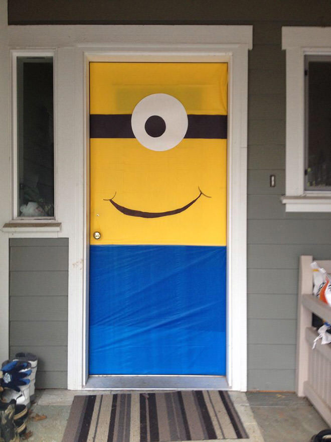 To craft this Minion door you can use fabric or plastic tablecloths for the backing and paper for the rest.