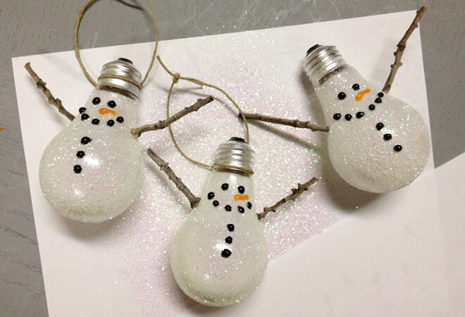 Re-purpose your old light bulbs into a family of sparkly snowmen for your Christmas tree!