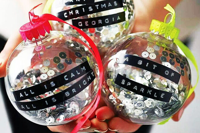 We love these colourful neon baubles filled with sequins and adorned with Christmas wishes! 