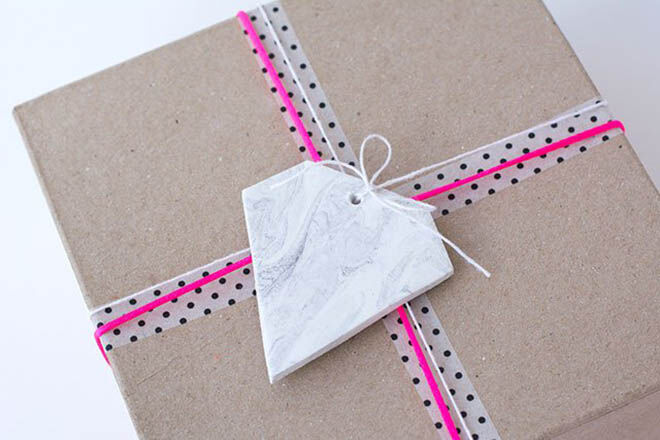 Crate a clay tag and add neon string for some super cool gift wrap