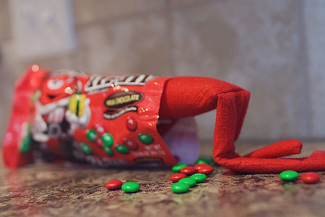 Elf on the Shelf getting his lolly fix