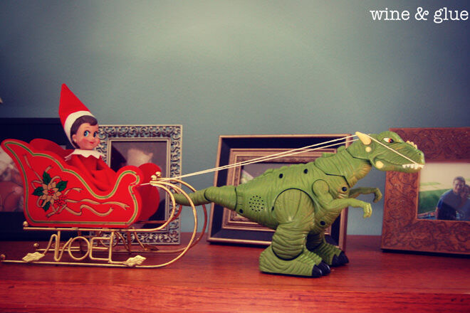 Elf on the Shelf takes a dinosaur ride