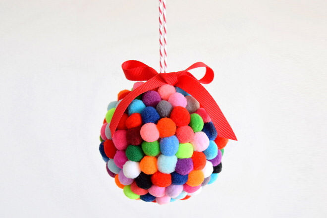 Grab some colourful mini pom poms and stick them onto a foam ball with some craft glue for this cute bauble