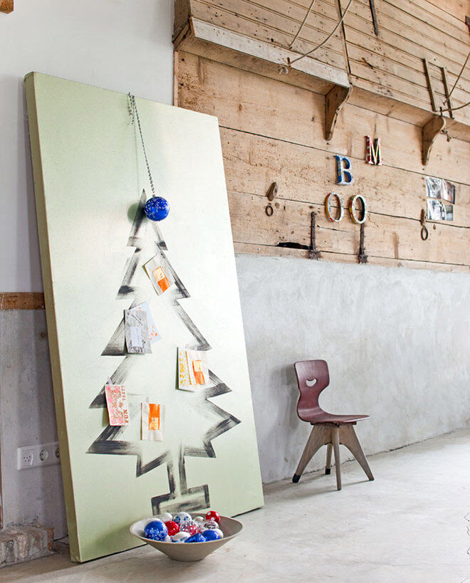 Paint a Christmas tree onto a large canvas for a hassle free decoration