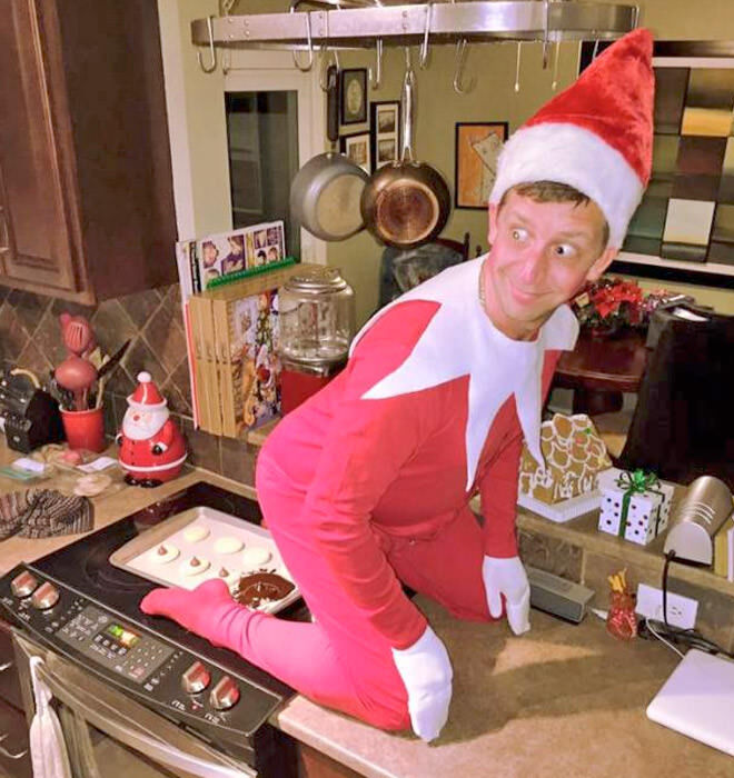 Dad turns into Elf on the Shelf
