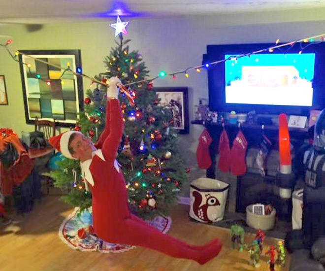 Dad turns into Elf on the Shelf