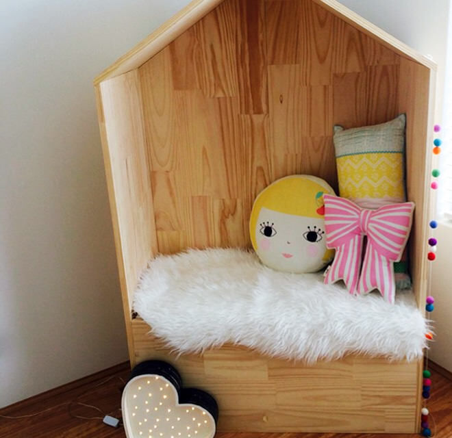 Ply wood house makes a cute reading nook for little ones