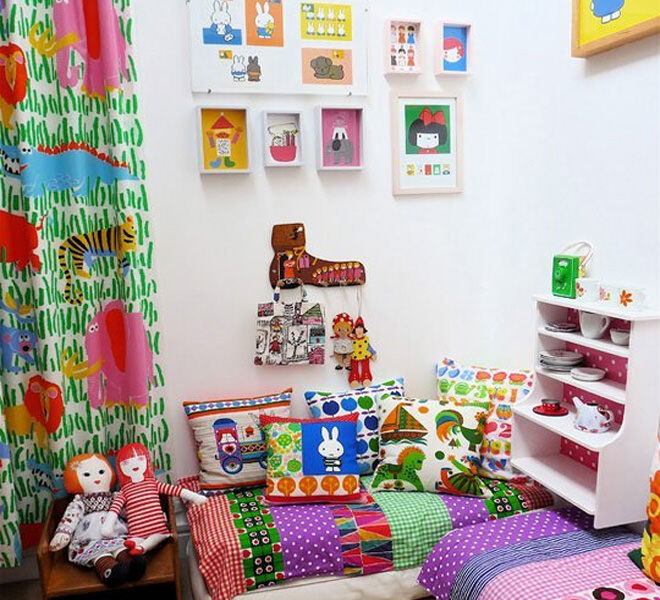 Repurpose your old cot mattress with a colourful quilt and you have a cool reading nook for your toddler