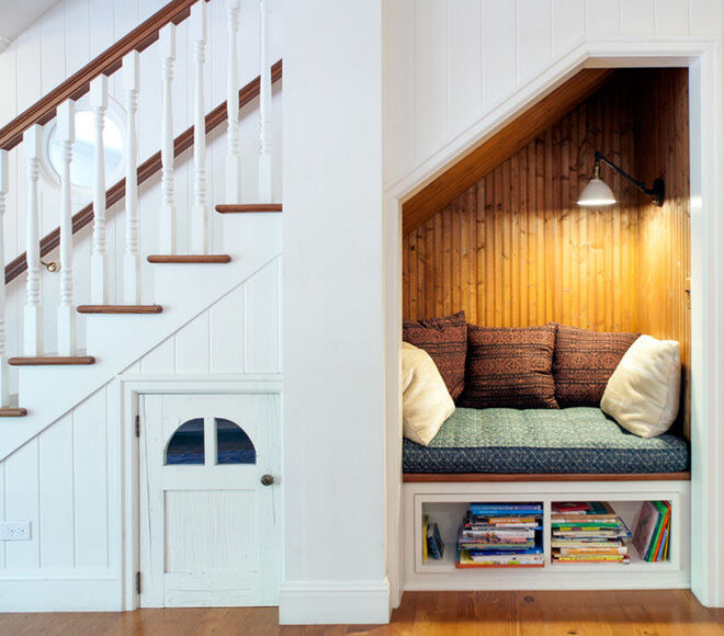 This cupboard under the stairs makes an adorable reading nook!