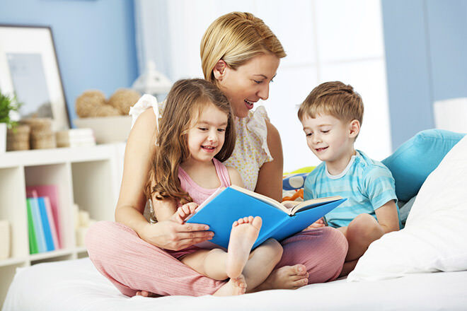 Mother reading to children