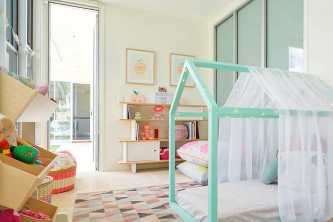 Pastel green kids bed frame with fairy lights