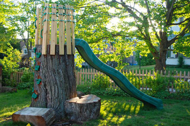 Tree trunk slide. Outdoor play areas.