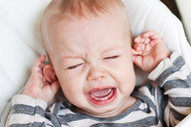 Baby teething pulling ears