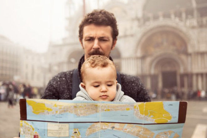 Italian man holding a baby