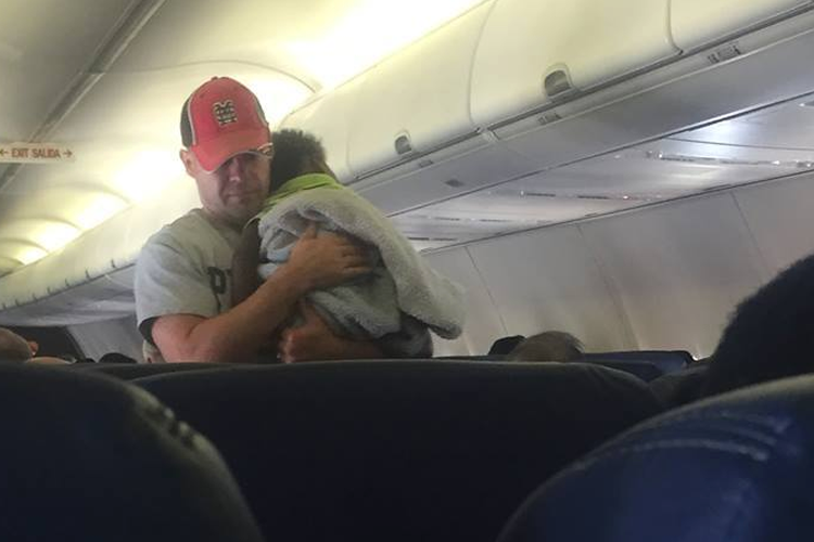 Random act of kindness by one dad on a plane