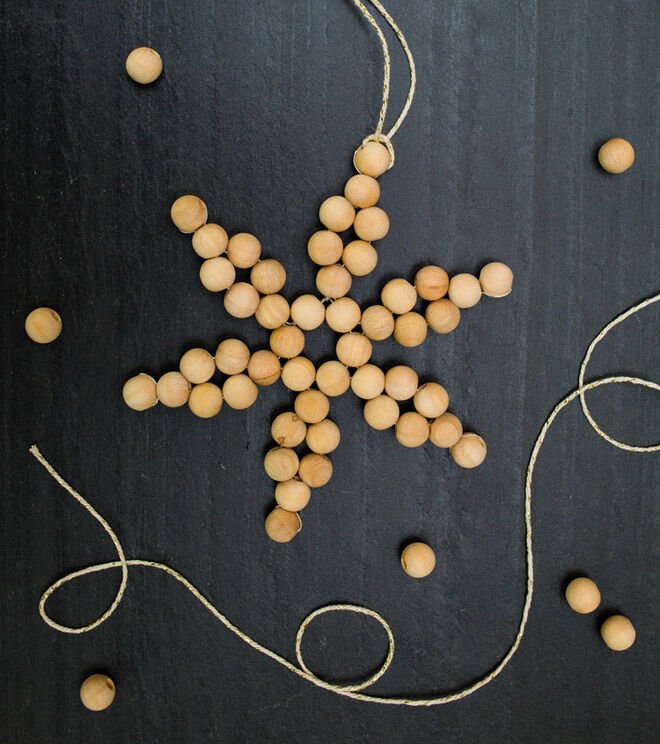Wooden beads threaded in to a star 