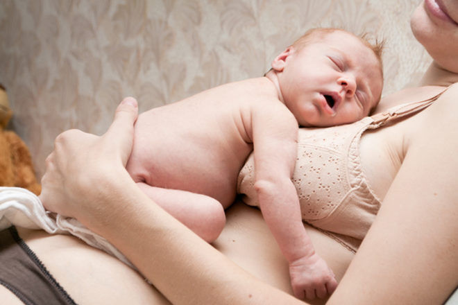 Newborn baby getting skin to skin contact on a mothers chest