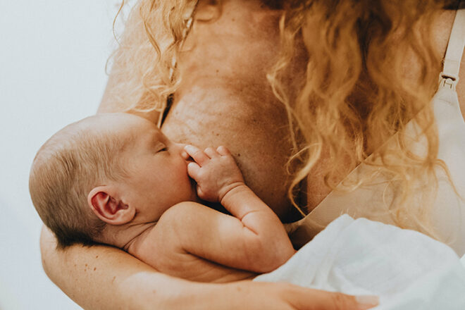 mother breastfeeding a newborn baby