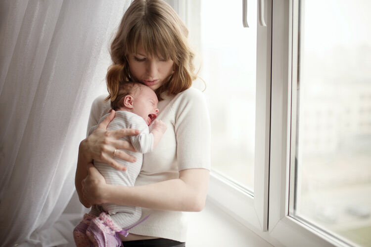 mum settling a crying baby